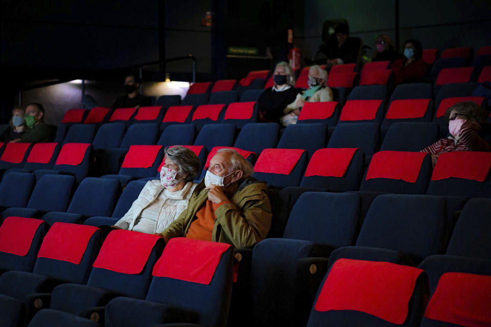 Cinema audiences watch Nomadland inside a movie theatre screen at Chapter, Cardiff, Wales as indoor hospitality and entertainment venues reopen to the public following the further easing of lockdown restrictions in Wales, Monday May 17, 2021. (Ben Birchall/PA via AP)