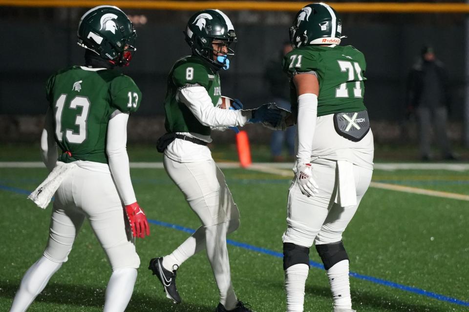 Joseph Academy at DePaul Catholic in an NJSIAA Non-Public B football semifinal on Friday, November 18, 2022. DP #8 De'zie Jones celebrates after scoring a touchdown in the first quarter.