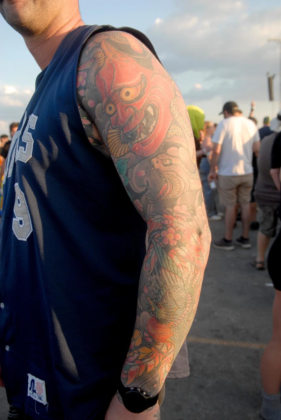 Luke Border poses with his tattoo at Louder Than Life on Friday. Sept. 22, 2023