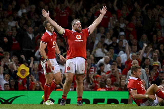 Wales’ Henry Thomas raises his arms during a match against England in Cardiff