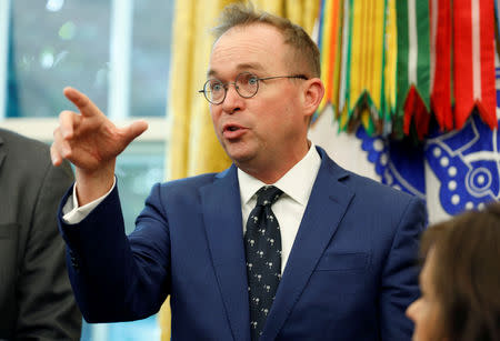 FILE PHOTO: Director of the Office of Management and Budget Mick Mulvaney speaks during an event hosted by U.S. President Donald Trump with workers on "Cutting the Red Tape, Unleashing Economic Freedom" in the Oval Office of the White House in Washington, U.S., October 17, 2018. REUTERS/Joshua Roberts/Files