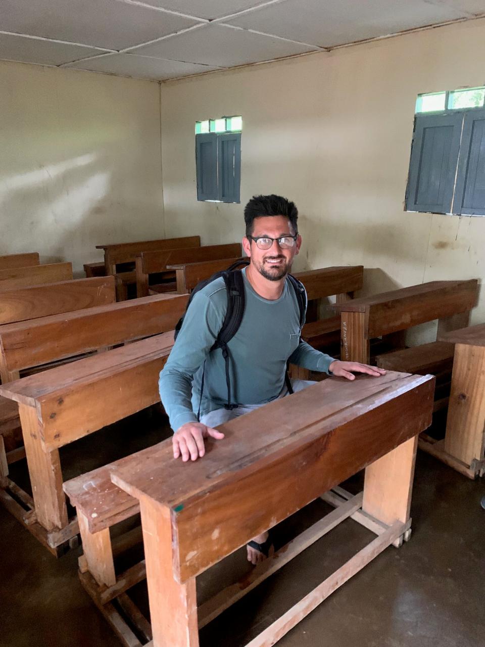 Dan Torsiello sits inside the school in Congo he and Jackie Jaramillo funded