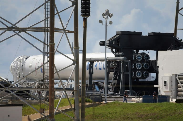 A SpaceX Falcon 9 rocket attached to the cargo-only capsule called Dragon lays on its side in 2012 in Cape Canaveral, Florida