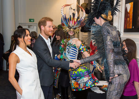 Britain's Prince Harry and Meghan, Duchess of Sussex, meet actors in costumes during a visit to Courtenay Creative, in Wellington, New Zealand October 29, 2018. Dominic Lipinski/Pool via REUTERS