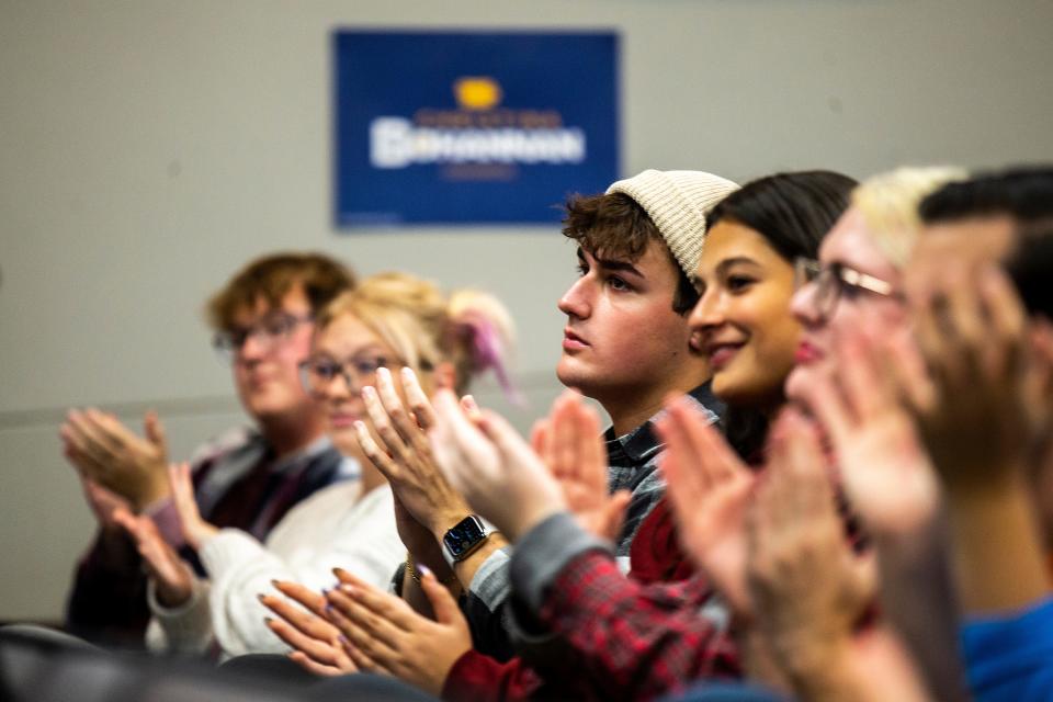 People applaud as 1st Congressional District candidate state Rep. Christina Bohannan, D-Iowa City, speaks during a "Get Out The Vote" rally with the University of Iowa Democrats, Wednesday, Oct. 19, 2022, at the Iowa Memorial Union in Iowa City, Iowa.