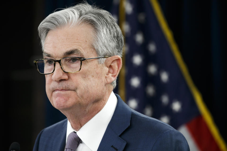 FILE - In this Tuesday, March 3, 2020 file photo, Federal Reserve Chair Jerome Powell pauses during a news conference to discuss an announcement from the Federal Open Market Committee, in Washington. In a series of sweeping steps, the U.S. Federal Reserve will lend to small and large businesses and local governments as well as extend its bond buying programs. The announcement Monday, March 23 is part of the Fed's ongoing efforts to support the flow of credit through an economy ravaged by the viral outbreak. (AP Photo/Jacquelyn Martin, File)