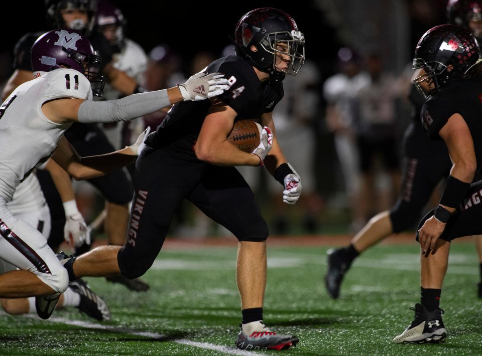 North Posey’s Jackson Graff (84) carries the ball as the North Posey Vikings play the Mount Vernon Wildcats Friday evening, Oct. 7, 2022. 