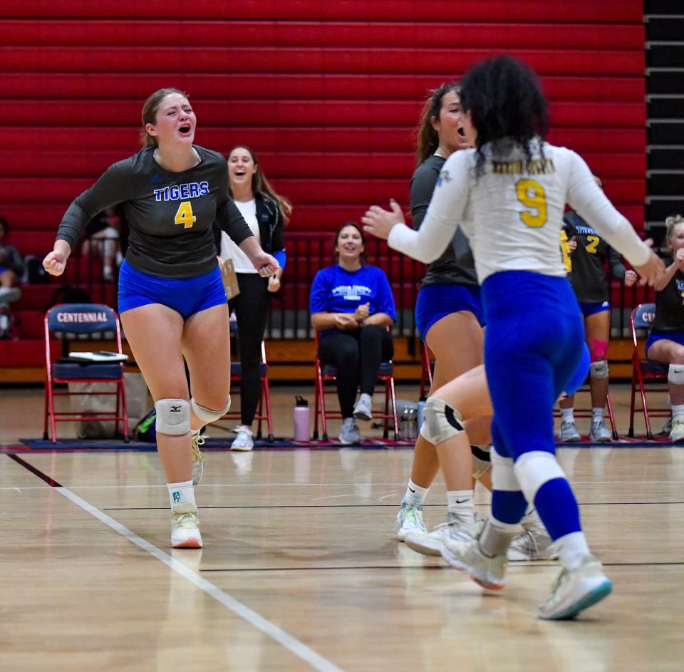 Martin County's Katelyn Bobo (4) celebrates a point with her teammates in a volleyball match against Centennial, Tuesday, Aug. 22, 2023, in Port St. Lucie. Centennial won in five sets.