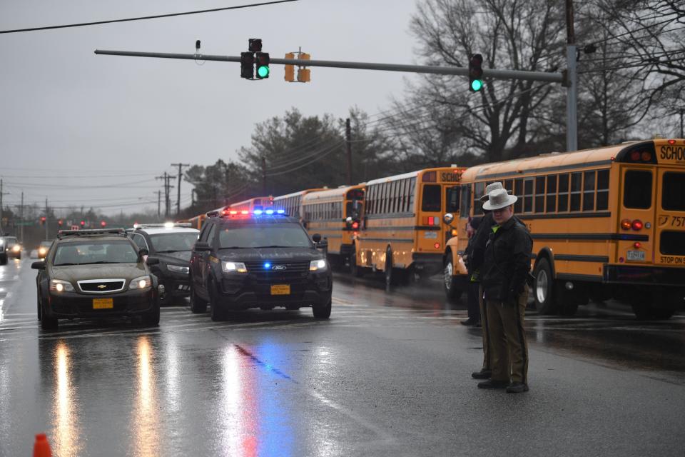 School buses, security and state troopers at the scene.