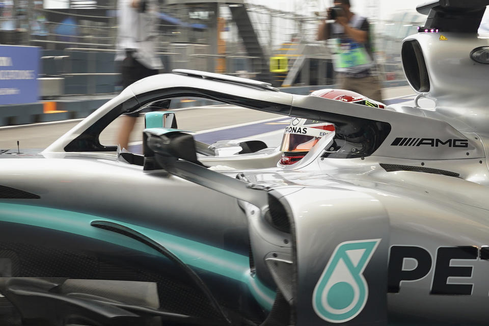 Mercedes driver Lewis Hamilton of Britain pulls out of his garage during the first practice session at the Marina Bay City Circuit ahead of the Singapore Formula One Grand Prix in Singapore, Friday, Sept. 20, 2019. (AP Photo/Vincent Thian)
