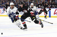 Buffalo Sabres right wing Tage Thompson (72) is pressured by Toronto Maple Leafs center Max Domi (11) during the first period of an NHL hockey game, Saturday, March 30, 2024, in Buffalo, N.Y. (AP Photo/Jeffrey T. Barnes)