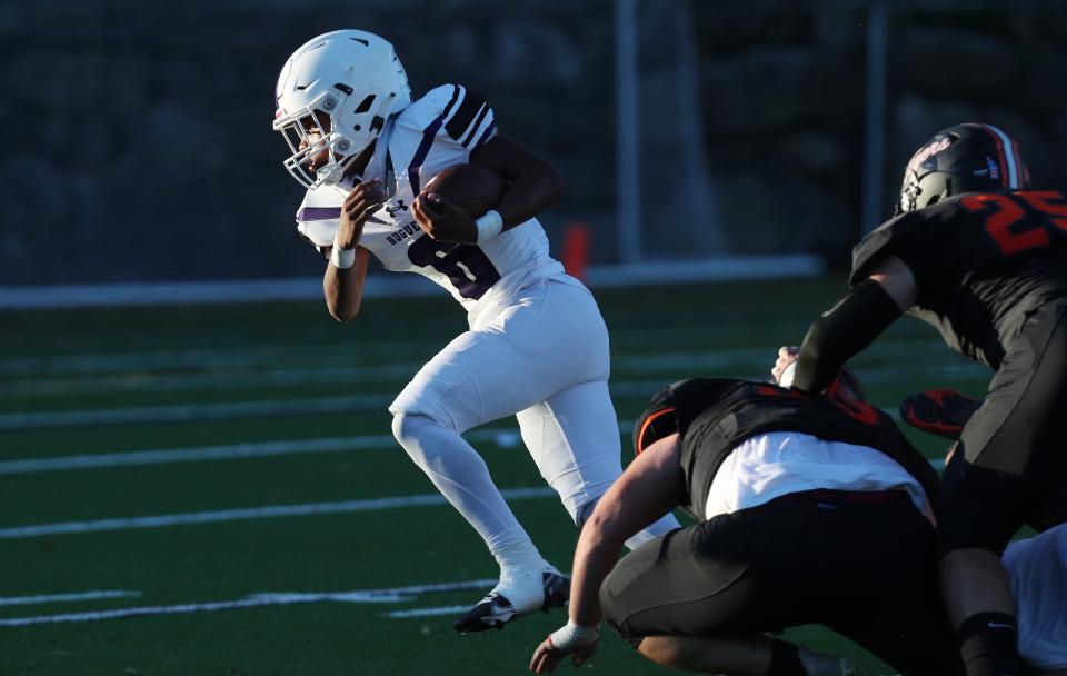 New Rochelle's Reyden Davis (6) looks for some running room in the Mamaroneck defense on a first-half run during football action at Mamaroneck High School Oct. 14, 2022.