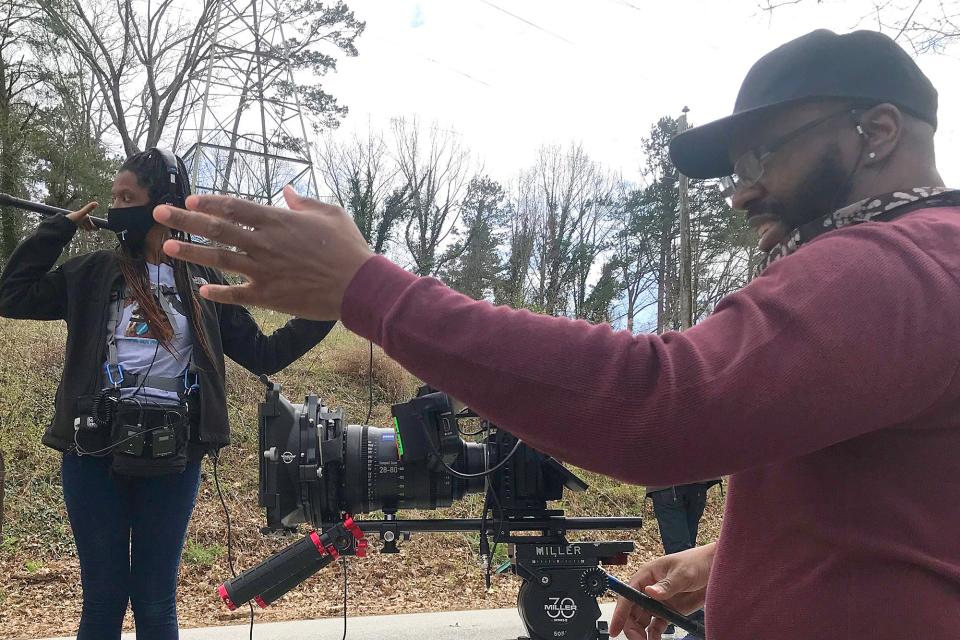 (L-R) Sound recordist Aigne Morris and director/cinematographer Keith Plummer film a scene from "Self Quaratined" in Gainesville, Ga. on Sunday, March 21, 2021.