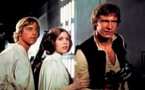 Mark Hamill, Carrie Fisher and Harrison Ford in the 1977 Star Wars - Credit: Twentieth Century Fox Home Entertainment via AP