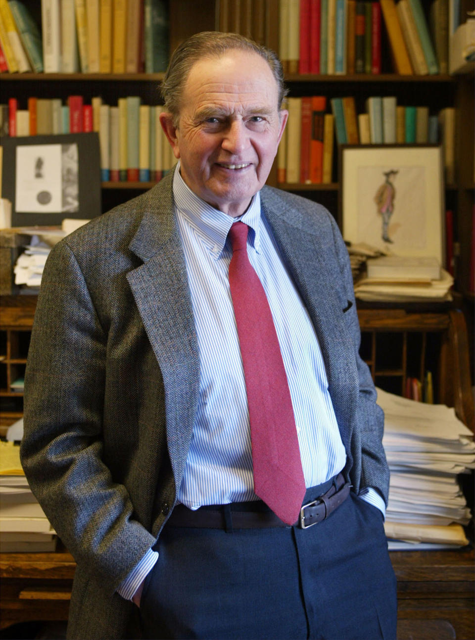 History Professor Bernard Bailyn poses in his Harvard University office in Cambridge, Mass., Feb. 26, 2003. Bailyn, one of the country’s leading historians of the early U.S., has died at age 97. Bailyn was best known for his Pulitzer Prize-winning “The Ideological Origins of the American Revolution,” among the most influential historical works of the past few decades. (AP Photo/Julia Malakie, File)