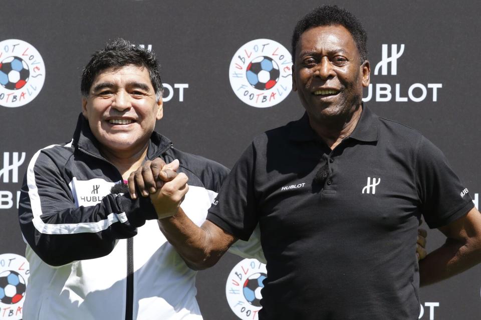Diego Maradona, left, and Pelé attend an event in Paris ahead of the 2016 European soccer championship.