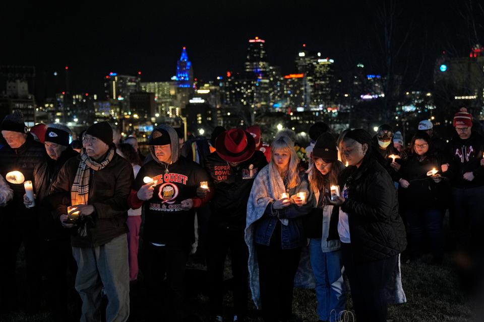 People attend a candlelight vigil for victims of a shooting at a Kansas City Chiefs Super Bowl victory rally Thursday, Feb. 15, 2024 in Kansas City, Mo.