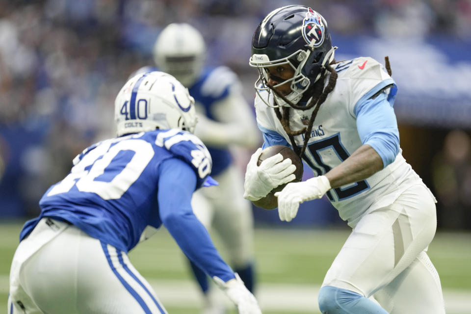 Tennessee Titans wide receiver DeAndre Hopkins, right, tries to get past Indianapolis Colts cornerback Jaylon Jones, left, during the second half of an NFL football game, Sunday, Oct. 8, 2023, in Indianapolis. (AP Photo/Michael Conroy)