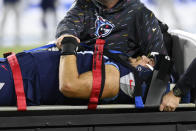 Tennessee Titans offensive tackle Taylor Lewan is taken off the field after being injured in the first half of an NFL football game against the Buffalo Bills Monday, Oct. 18, 2021, in Nashville, Tenn. (AP Photo/Mark Zaleski)