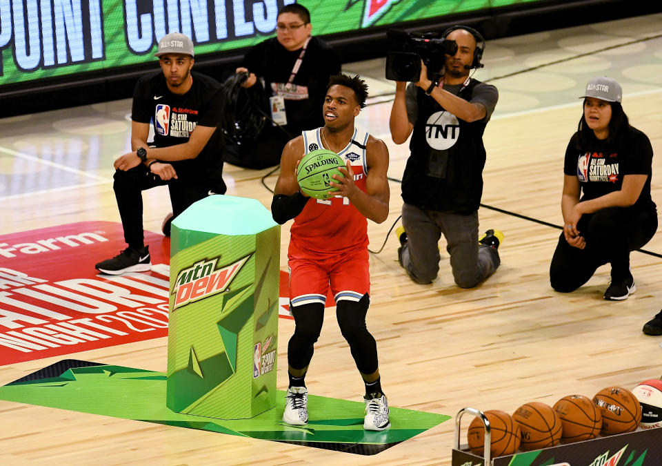 Buddy Hield edged out Devin Booker to win the 3-point contest on Saturday night the United Center.