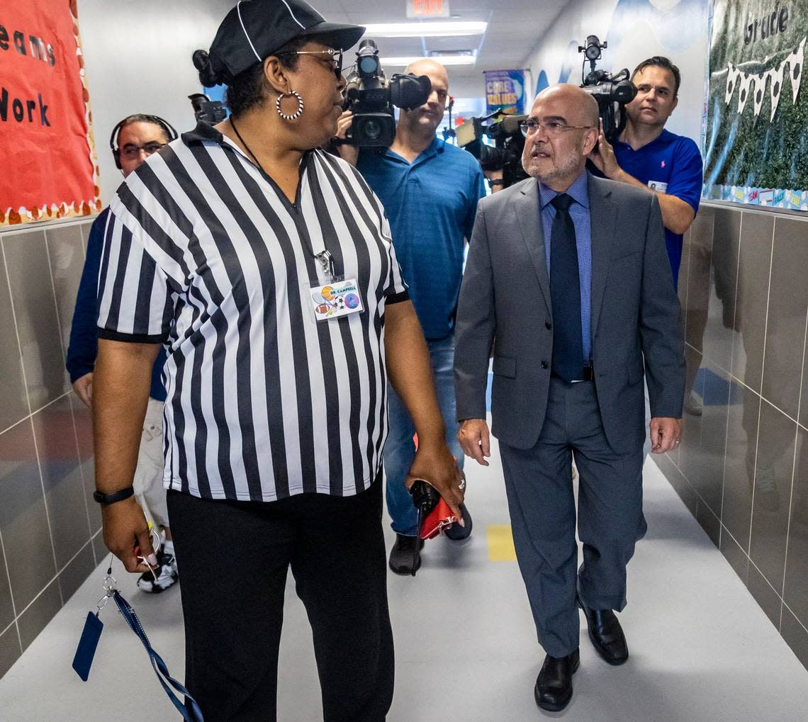 Dr. Orna Campbell, left, takes Miami-Dade Schools Superintendent Jose Dotres for a quick tour of a few classrooms at Comstock Elementary, 2420 NW 18th Ave., on Wednesday in Allapatah. Dr. Campbell, the school’s principal, dressed as a referee because now that the school year has started, she is back in the game.