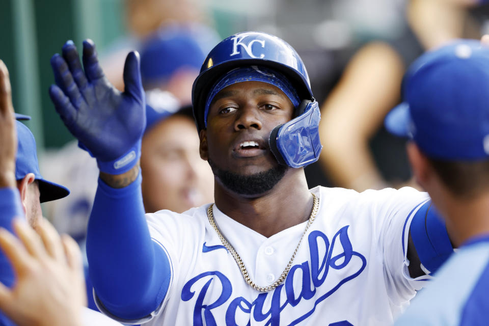 Kansas City Royals' Jorge Soler celebrates in the dugout after hitting a solo home run in the fourth inning of a baseball game against the Chicago White Sox at Kauffman Stadium in Kansas City, Mo., Monday, July 26, 2021. (AP Photo/Colin E. Braley)