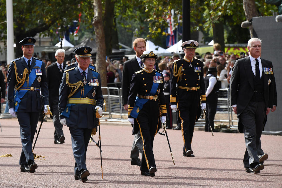 <p>LONDON, ENGLAND - SEPTEMBER 14: (Back row) Prince William, Prince of Wales, Prince Harry, Duke of Sussex, Vice Admiral, Sir Timothy Lawrence (front row) King Charles III, Princess Anne, Princess Royal and Prince Andrew, Duke of York walk behind the coffin during the procession for the Lying-in State of Queen Elizabeth II on September 14, 2022 in London, England. Chris J Ratcliffe/Pool via REUTERS</p> 