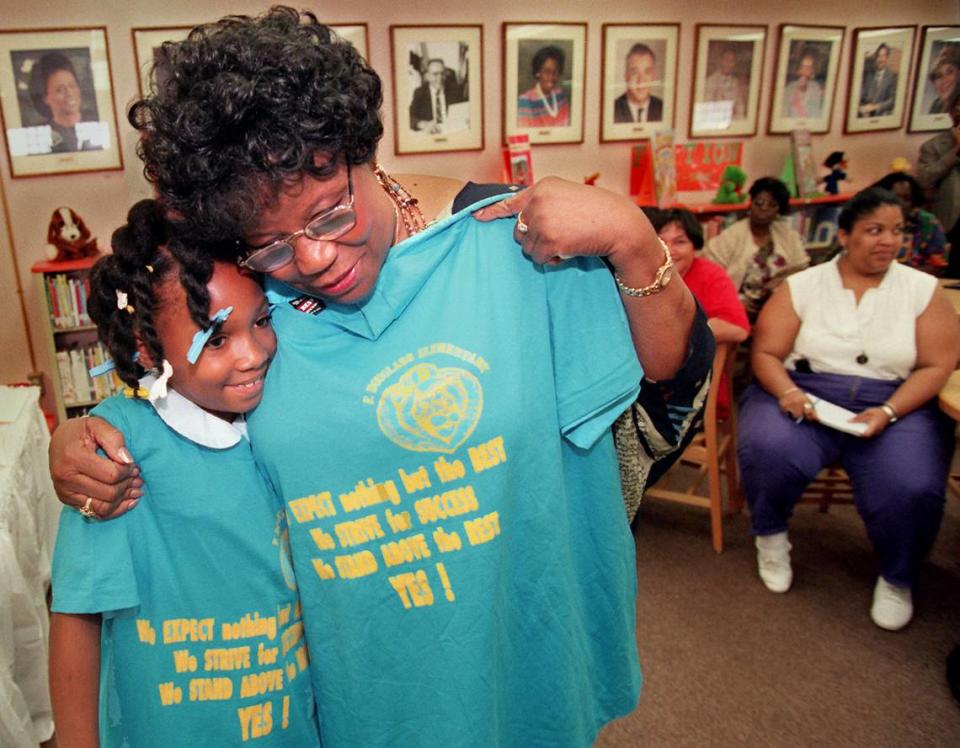 MIami Congresswoman Carrie Meek lunched with students of Frederick Douglas Elementary before holding a press conference to discuss the National School Lunch Act and cuts on other child-care programs. Betty Jackson, a 9-year-old third grader, got a hug after presenting Meek a T-shirt.