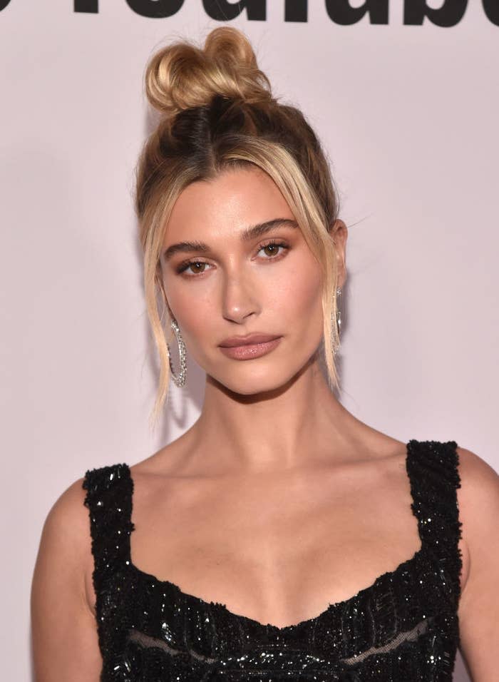 A closeup of Hailey at an event rocking an updo