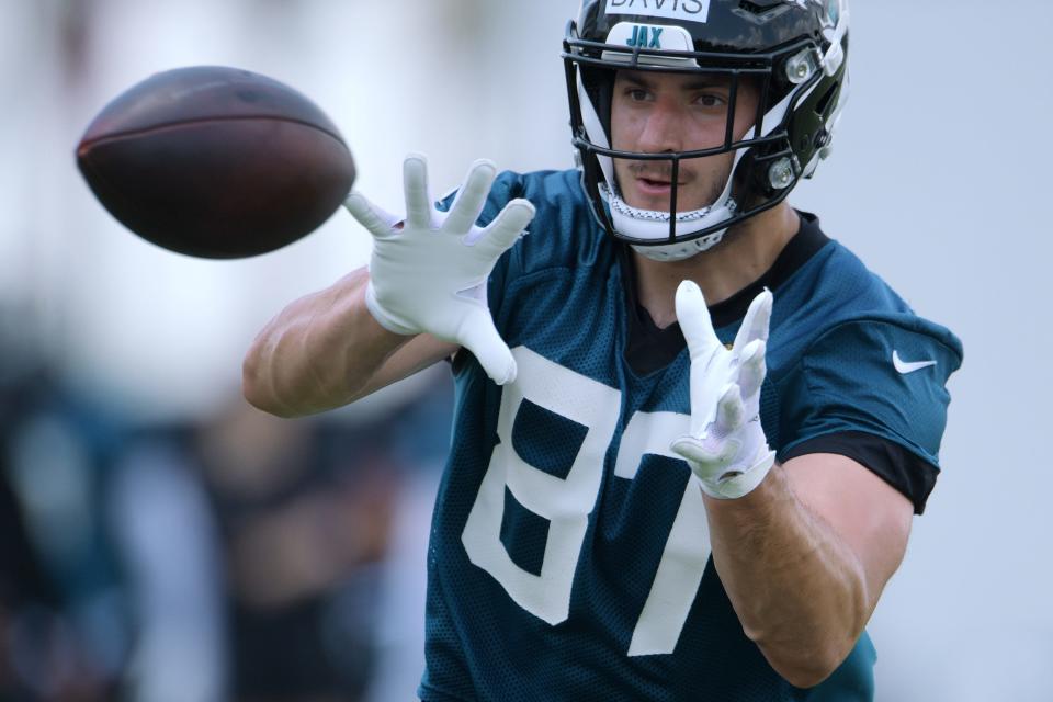 Jaguars (87) TE Tyler Davis pulls in a pass during drills at Thursday's OTA session. The Jacksonville Jaguars held their Thursday session of organized team activity at the practice fields outside TIAA Bank Field, May 27, 2021. 
