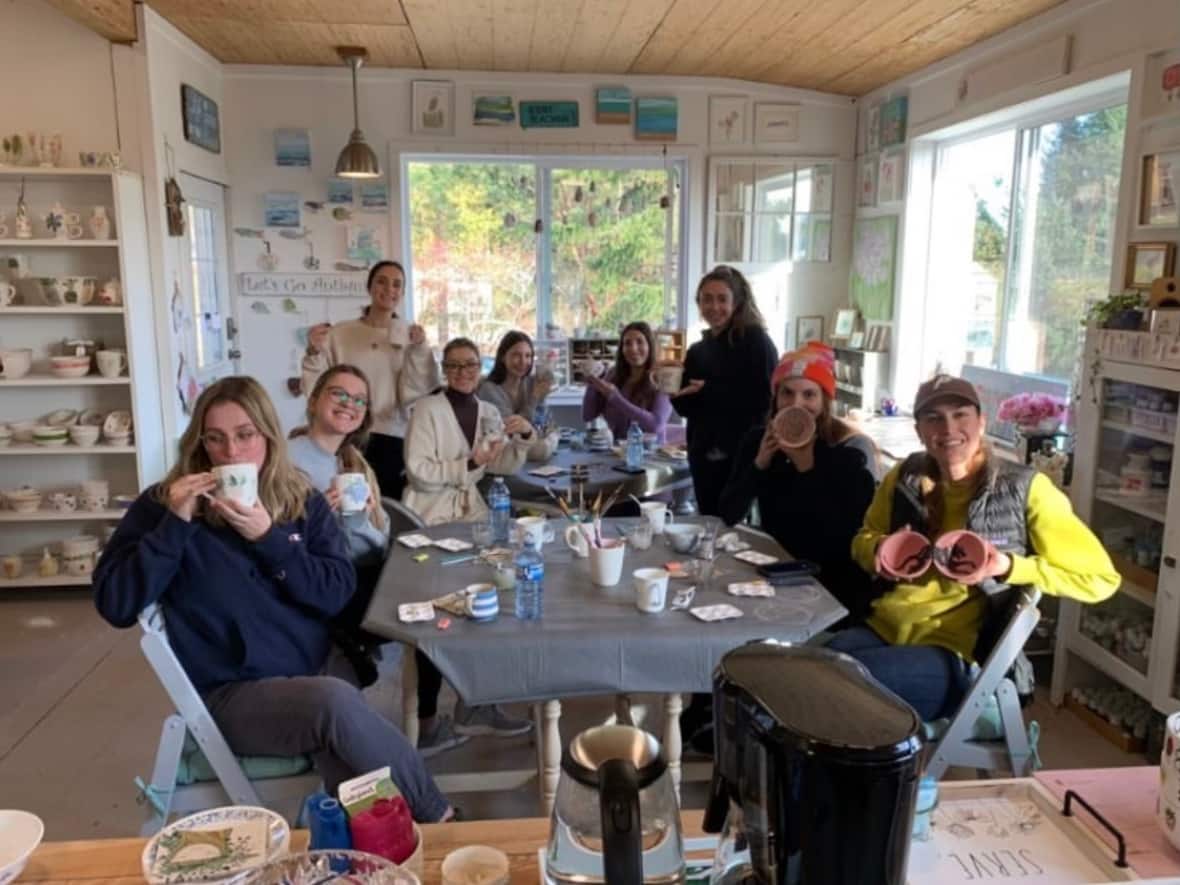 A photo of some of the group during their weekend stay at a Gibsons, B.C., Airbnb rental, before they found hidden cameras in the bathrooms. (Submitted by Kennedy Calwell - image credit)