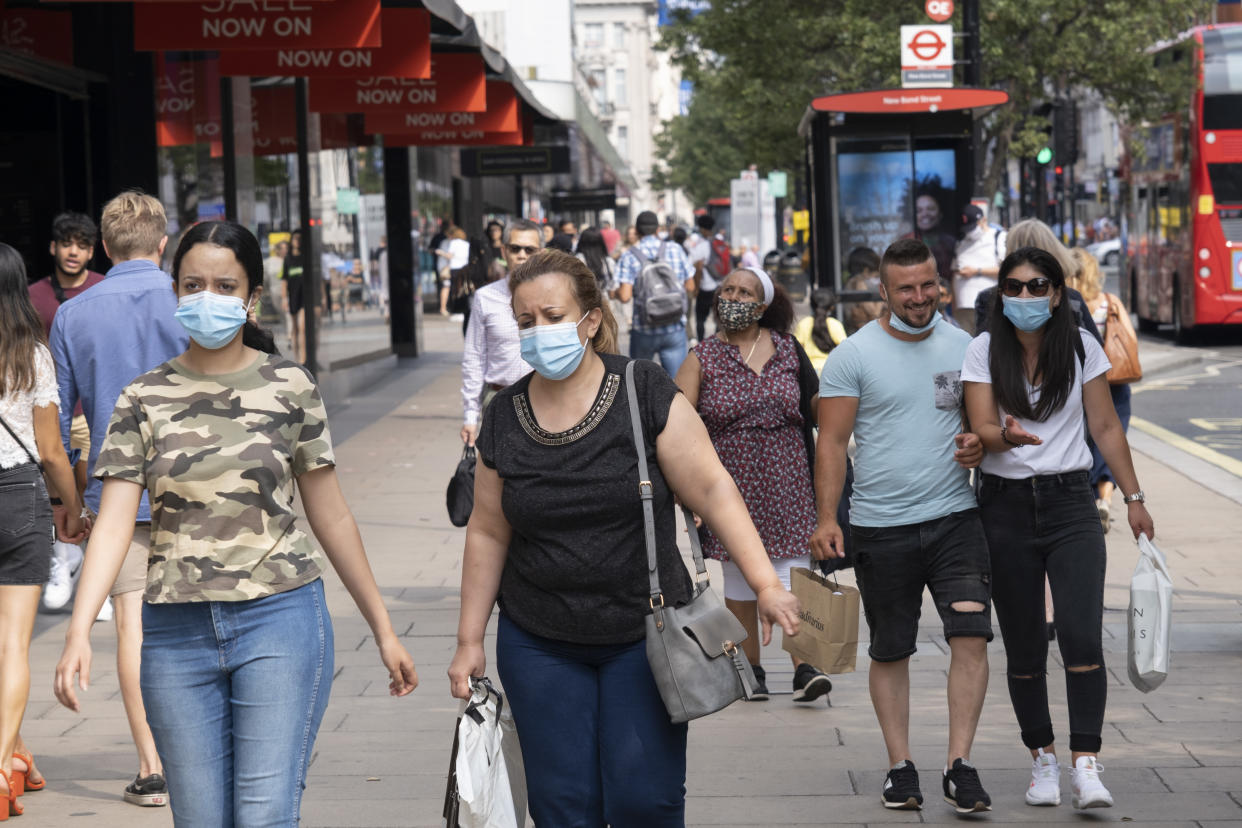 As Britain enters a period of deep recession, with some shops closing either temporarily or permanently as the economic downturn caused by the Covid-19 pandemic cuts hard, shoppers wearing face masks continue to come to the West End to Oxford Street on 13th August 2020 in London, United Kingdom. The Office for National Statistics / ONS has announced that gross domestic product / GDP, the widest gauge of economic health, fell by 20.4% in the second quarter of the year, compared with the previous quarter. This is the biggest decline since records began. The result is that Britain has officially entered recession, as the UK economy shrank more than any other major economy during the coronavirus outbreak. (photo by Mike Kemp/In PIctures via Getty Images)