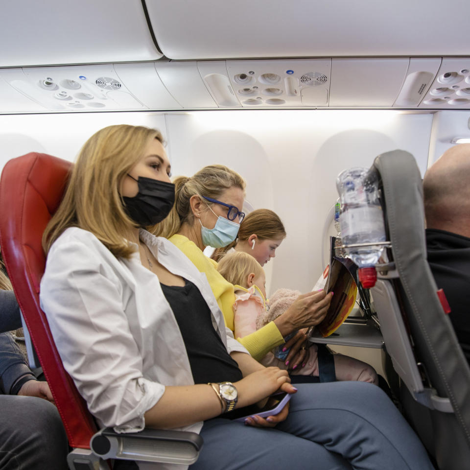 a row of travelers on the plane