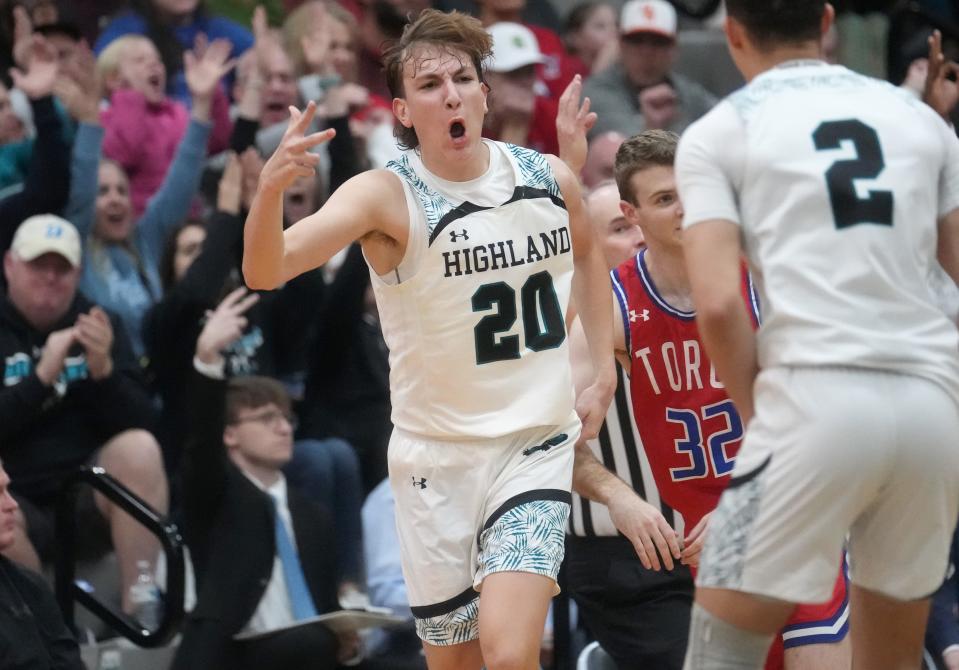 Highland Hawks' Ryan Moon (20) celebrates his 3-pointer against the Mountain View Toros at Highland High gym in Gilbert on March 1, 2023.