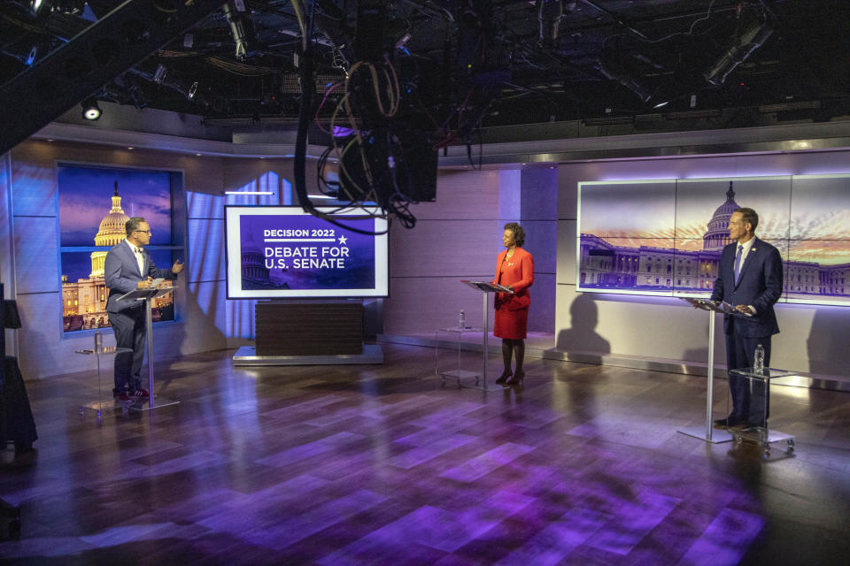 Spectrum News 1 political anchor Tim Boyum, left, moderates a televised debate between Democratic candidate for U.S. Senate Cheri Beasley, center, and Republican challenger U.S. Rep. Ted Budd, R-N.C., Friday, Oct. 7, 2022, at Spectrum News 1 studio in Raleigh, N.C. (Travis Long/The News & Observer via AP, Pool)