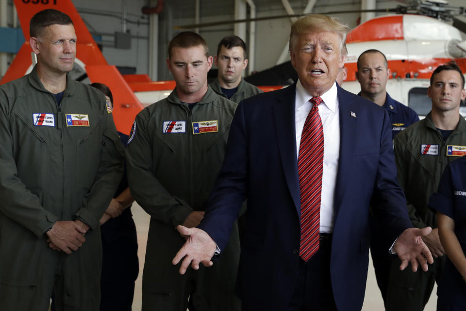 President Donald Trump speaks about recent flooding and rainfall in Texas at U.S. Coast Guard Air Station Houston after he arrived at Ellington Field and before going to a "Howdy Modi: Shared Dreams, Bright Futures" event with Indian Prime Minister Narendra Modi, Sunday, Sept. 22, 2019, in Webster, Texas. (AP Photo/Evan Vucci)