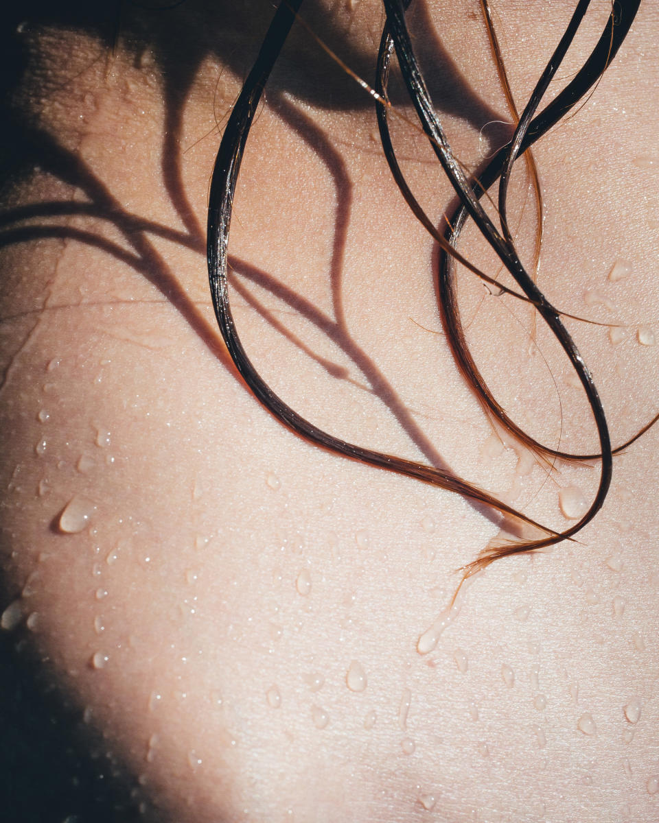 a person's wet skin and hair