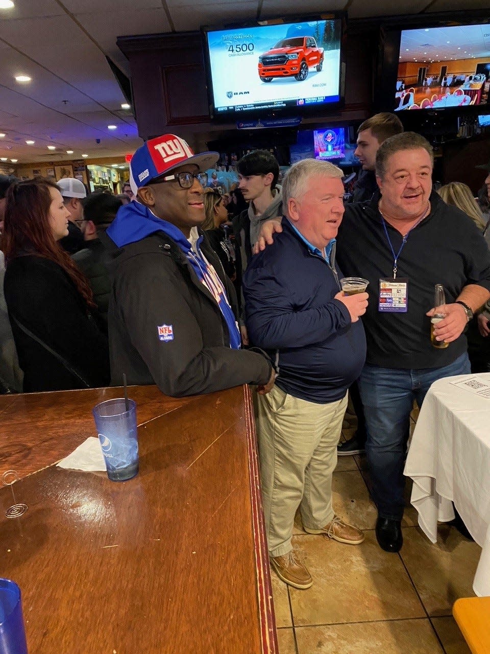 Stephen Baker (left), former New York Giants receiver and member of the team that won Super Bowl XXV in 1991, served as a celebrity judge for the final round of Pizza Bowl IV.
