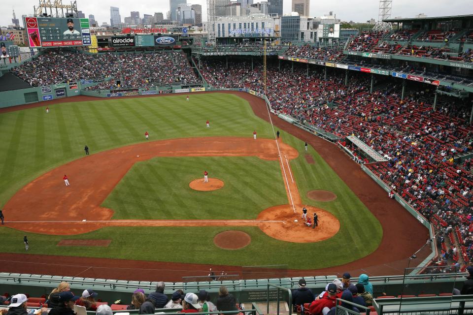The Boston Red Sox play against the Miami Marlins during the third inning of a baseball game, Saturday, May 29, 2021, in Boston. Saturday marks the end of most COVID-19 restrictions in Massachusetts. (AP Photo/Michael Dwyer)