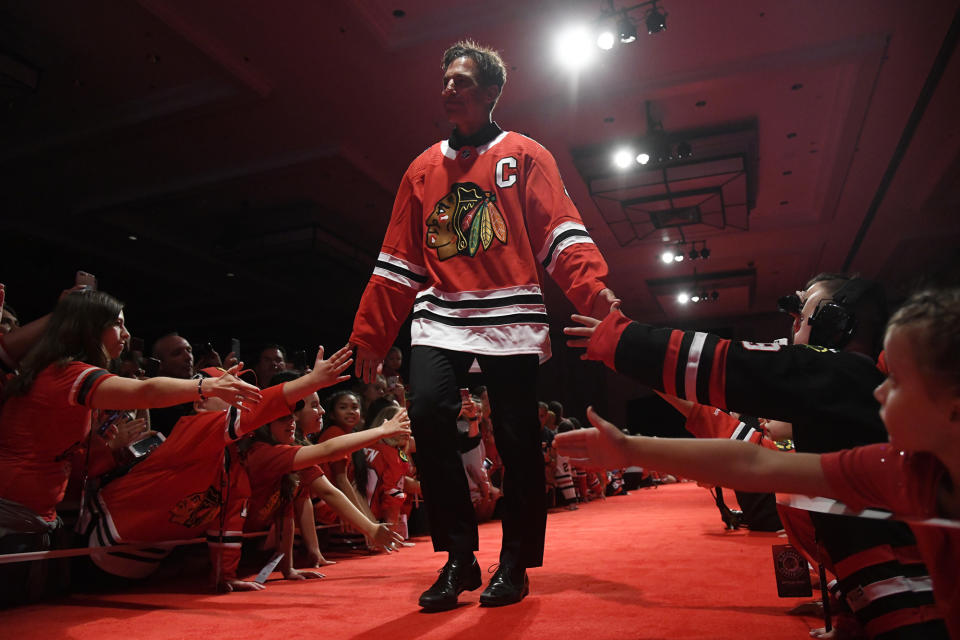 FILE - Chris Chelios is introduced to fans during the Chicago Blackhawks' convention Friday, July 27, 2018, in Chicago. The Blackhawks have decided to retire Hall of Fame defenseman Chris Chelios’ No. 7 jersey. The Blackhawks had Pearl Jam frontman Eddie Vedder deliver the news to his longtime friend during the band’s concert at the United Center on Thursday night, Sept. 7, 2023. (AP Photo/Annie Rice, File)