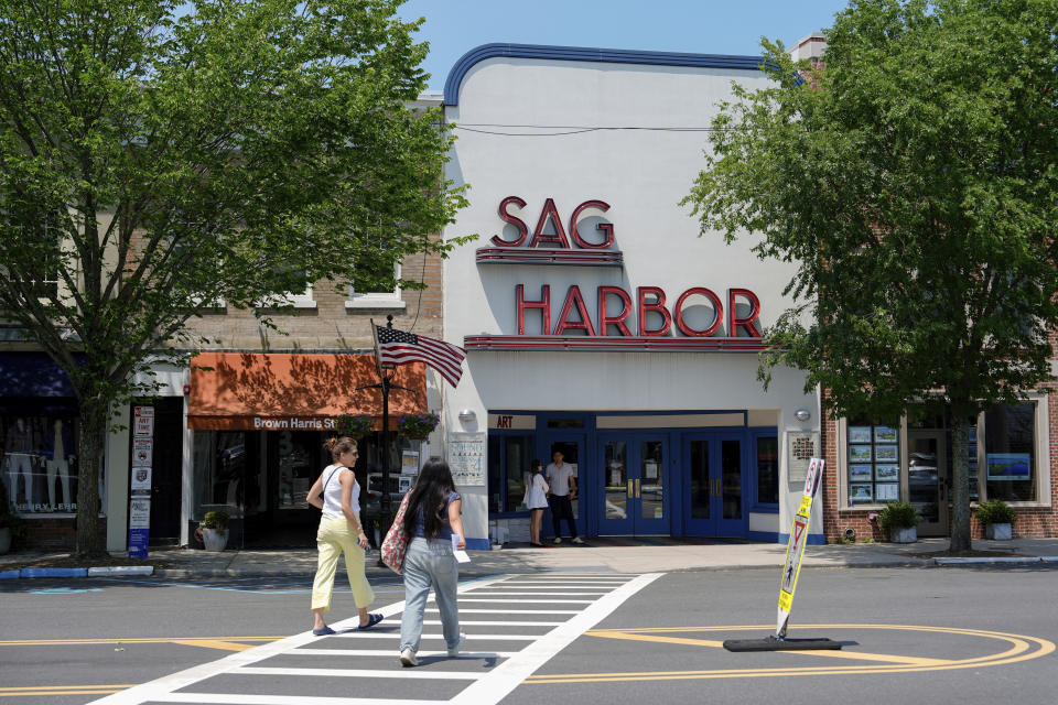 People walk along Main Street, Tuesday, June 18, 2024, in Sag Harbor, N.Y. Pop star Justin Timberlake was charged early Tuesday with driving while intoxicated in Sag Harbor after police said he ran a stop sign and veered out of his lane in the posh seaside summer retreat. (AP Photo/Julia Nikhinson)