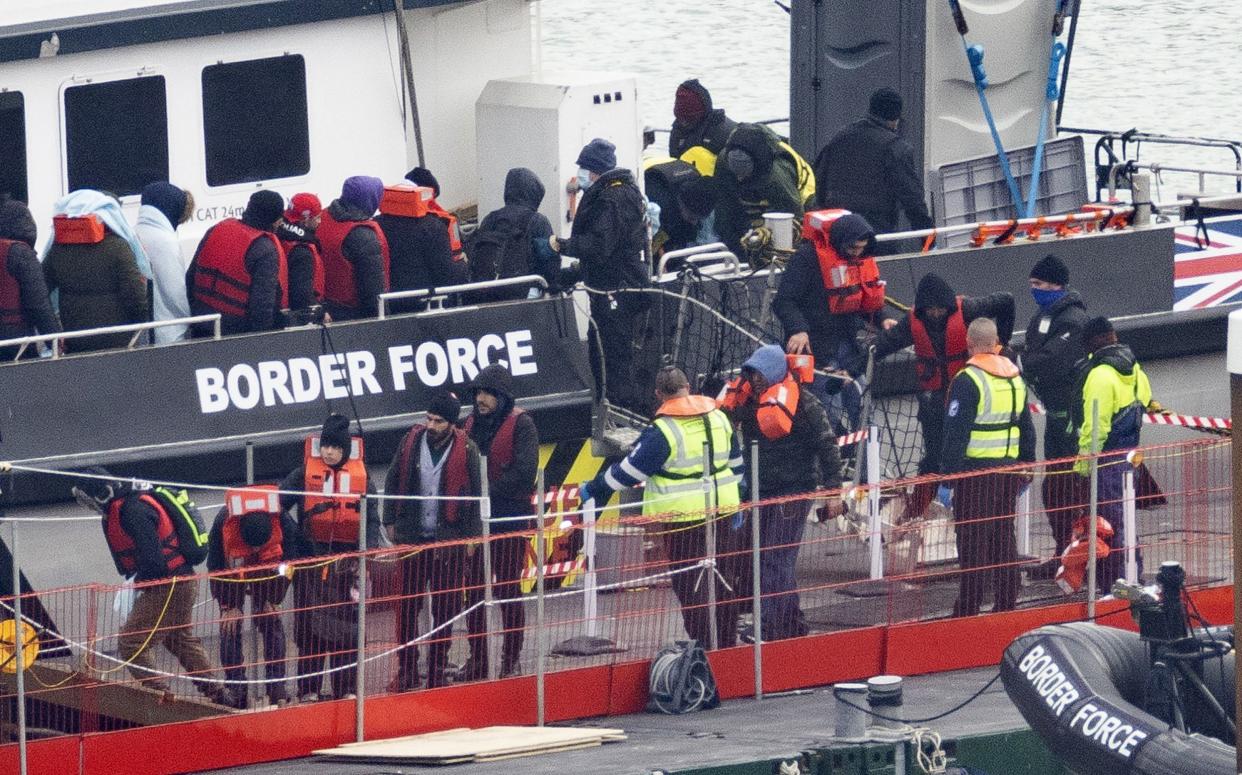 Migrants are removed from a Border Force vessel off the coast of Dover in March 2023