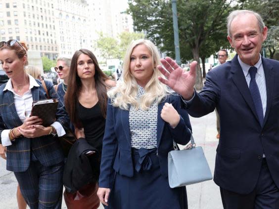 Virginia Giuffre, one of Epstein’s accusers, arrives with her lawyer for a hearing in the criminal case against Jeffrey Epstein in August (Reuters)