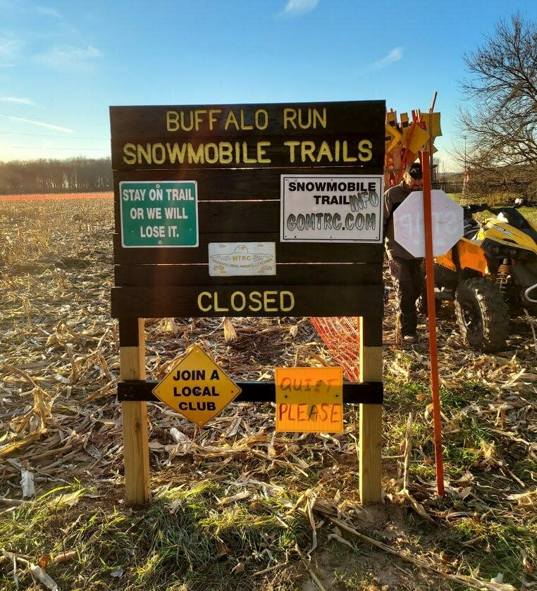 A sign marks the new trailhead for the Buffalo Run Snowmobile Trail along Pear Road in South Bend.