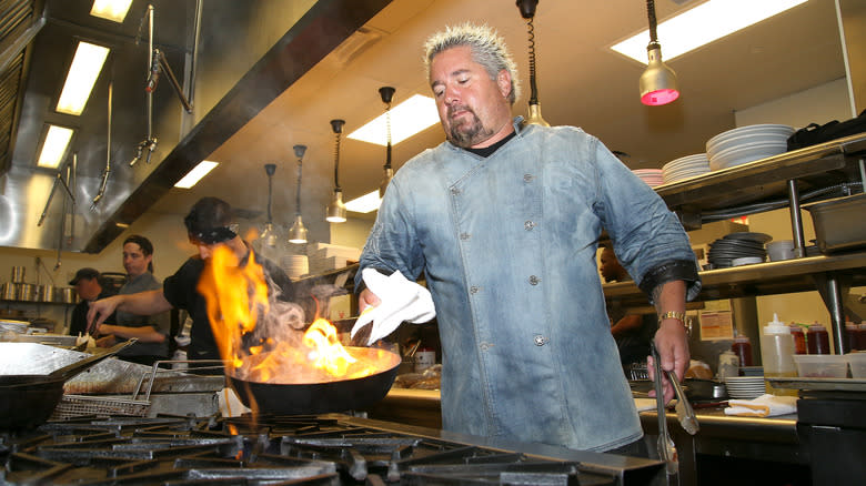 Guy Fieri cooking at his restaurant