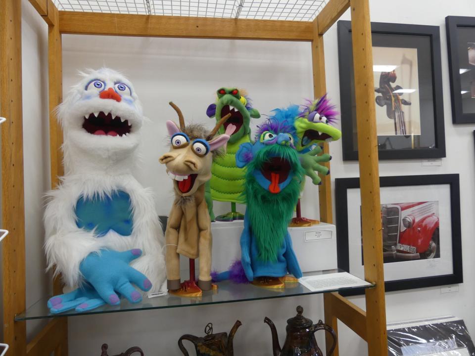 These hand-crafted puppets are available at By Hand Gallery.