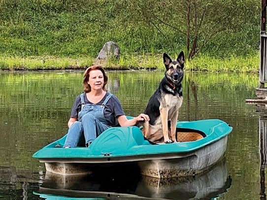 <span><span>Patty paddle boating with her pup, Sable, 2023</span></span>