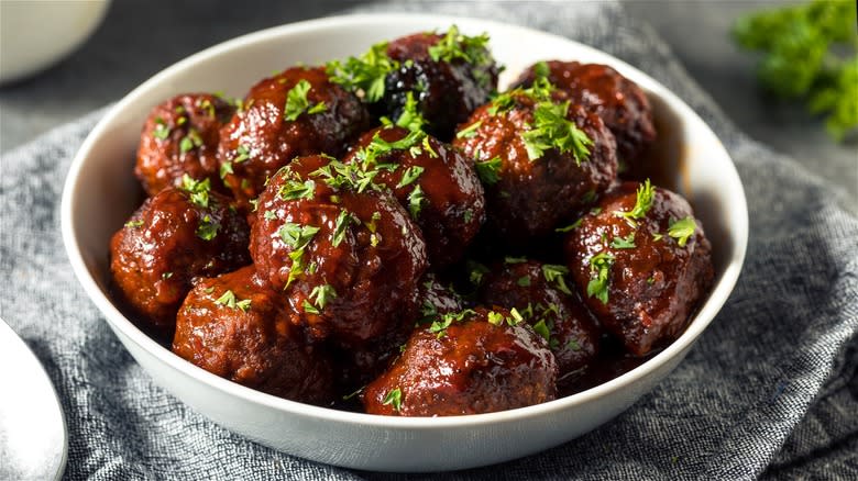 Meatballs in dark sauce with parsley