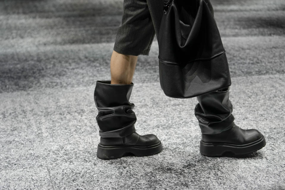 A model wears a creation as part of the men's Giorgio Armani Fall-Winter 2024-2025 collection, that was presented in Milan, Italy, Saturday, Jan. 13, 2024. (AP Photo/Luca Bruno).