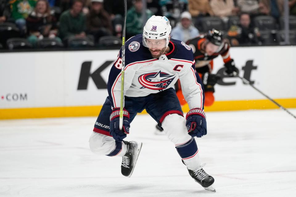 Columbus Blue Jackets' Boone Jenner (38) chases the puck during the second period of an NHL hockey game against the Anaheim Ducks Friday, March 17, 2023, in Anaheim, Calif. (AP Photo/Jae C. Hong)